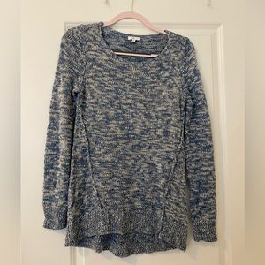 Blue and white long sleeve sweater.